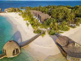An aerial view of OUTRIGGER Maldives Maafushivaru, a luxury high-end resort located in Ari Atoll.