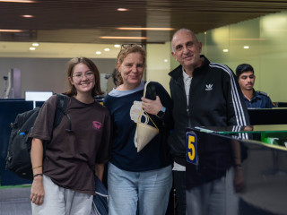 The first tourist of 2025 and his family being welcomed at the airport