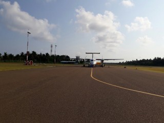 An aircraft prepares for takeoff on the runway of a local domestic airport