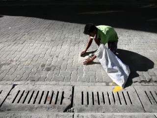 An expatriate working on a street in capital city Malé