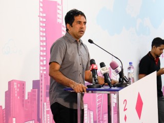 Economic Minister Mohamed Saeed speaking at ruling party rally