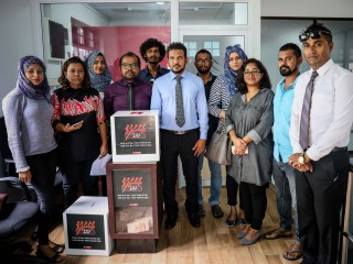 RaajjeTV staff at MBC premises on Sunday, paying up the fine of MVR 500,000 