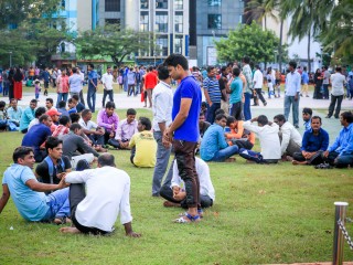 Migrant workers enjoying holiday at a local park in Male'; migrants who dominate the workforce "face a range of entrenched abuses from employers" - Human Rights Watch