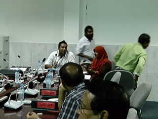 MP Amir (R) leaving session 