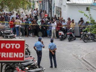 File photo shows police cordon off the area around Faris' home