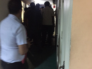 Police officers enter former President Gayoom's home