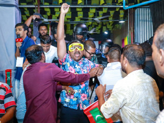 MP Abdulla Ahmed at the rally on Wednesday, wearing eyewear to protect himself from pepper-spray