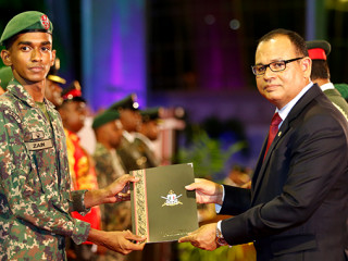 Minister of Defence and National Security Adam Shareef (R) at Tuesday night\'s event