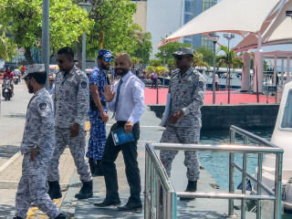MP Ahmed Faris Maumoon being escorted from detention by officers of the Maldives Correctional Services