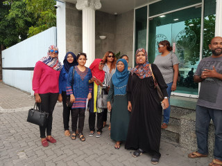 Yumna Maumoon (center left) at police headquarters