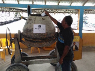 MDP members voting in cement mixer machines