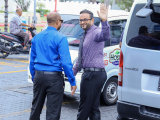 Ex-VP Ahmed Adeeb waves to the press