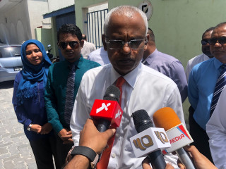Opposition presidential candidate Ibrahim Mohamed Solih speaks to the media after meeting with members of the Malé City council