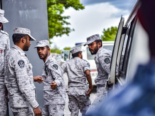 Corrections officials transporting convicts for court hearings