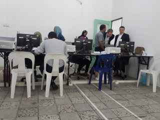 Voters filing applications at the Elections Commission re-registration office