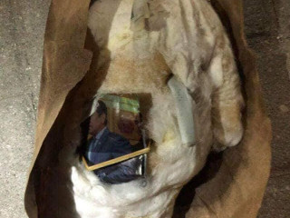Residents found an object wrapped in cotton bearing a photograph of incumbent President Abdulla Yameen