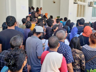 Maldivian citizens in line to vote in previous elections conducted across the island nation