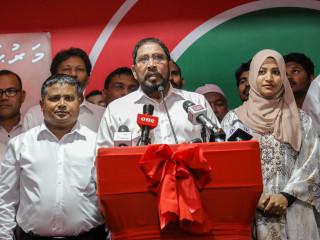 Qasim Ibrahim speaking at a rally at the JP headquarters