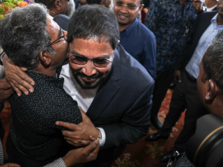 Jumhooree Party leader Qasim Ibrahim is greeted by fellow MP Mohamed Waheed (L) upon his return to the Maldives on October 4th, 2018