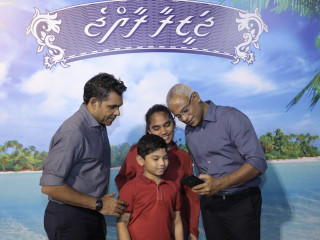 Solih and Faisal take a photo with supporters