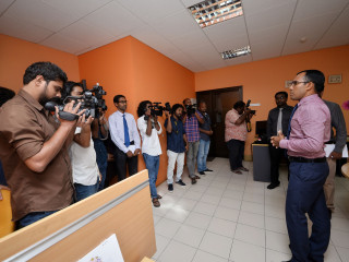 Communication Minister Jamaal speaks to the press