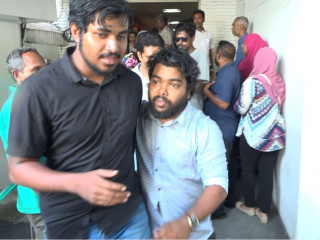 Dhaanish being led away from the hospital after being assaulted
