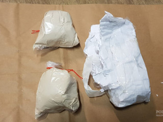 The man was found with two rubber packets containing what the police attest to be narcotics