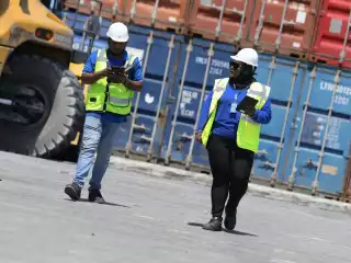 A female employee and a male employee working at the MPL port