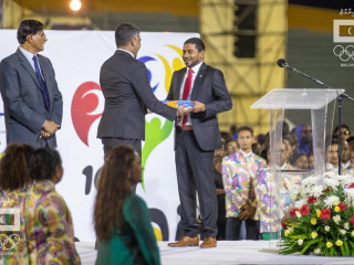 Minister Mahloof receives IOIG flag for 2023 games