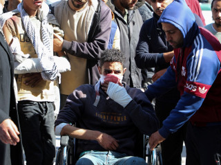 Palestinians mourn people killed in Israeli strikes, at Al-Aqsa hospital