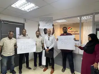MDP members are staging a protest inside the Anti-Corruption Commission (ACC), calling for the resignation of the commission's president, Adam Shamil. | MDP