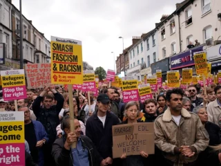 Protesters demonstrate against a planned far-right anti-immigration protest in London