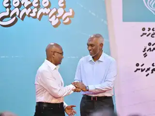 President Muizzu shakes hands with Moosa Ali Jaleel, who will be running in the Local Council Election under PNC's ticket for Malé Mayor. | Mihaaru