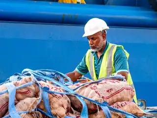 An MPL employee works at the Male' Commercial Port to expedite the clearance of perishable food items during a public holiday.