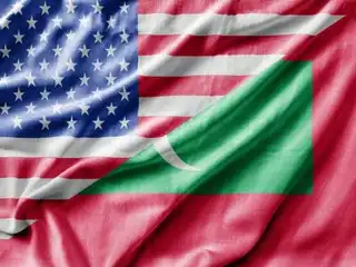 The flags of the United States and the Maldives.