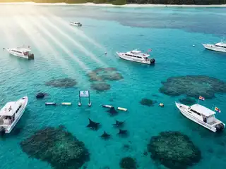 A registered dive boat operates within the protected SAMPA area in Alif Dhaal Atoll, Maldives.
