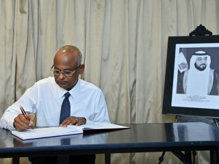 The President signs the book of condolences open in memory of the late President of UAE