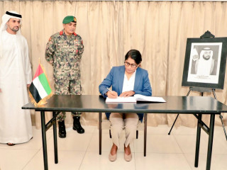 Minister of Defence Mariya Didi signing the Book of Condolence in honour of the late President of the UAE and Ruler of Abu Dhabi Sheikh Khalifa bin Zayed Al Nahyan
