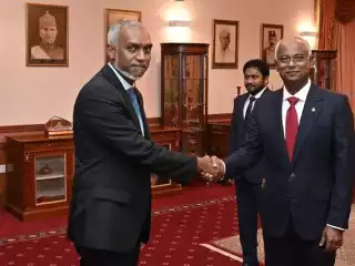 A photo of President Muizzu (L) and former President Solih (R) together