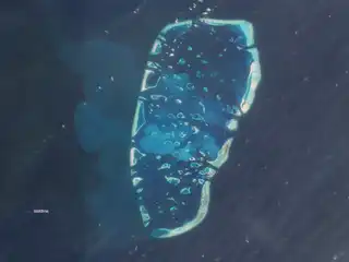 A large area of South Malé Atoll has been affected by a significant spread of sediment. | Screen image