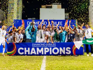 Pakistan lifts the Diamond Jubilee tournament trophy.