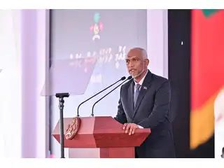 The president takes the podium at the official National Day ceremony, on 15 August 2026