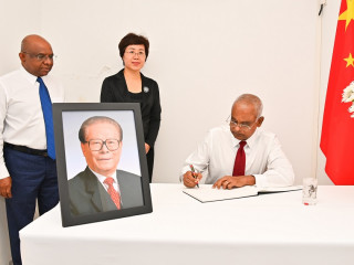The President signs book of condolences for the late Chinese President Jiang Zemin