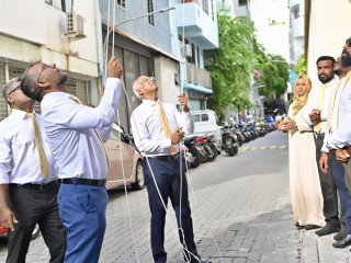 Flag hoisting ceremony at MDP secretariat to mark party's 19th anniversary