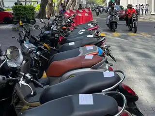 Parking stickers on motorcycles near Velaanaage