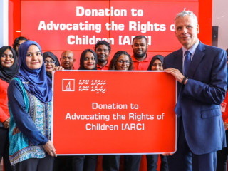 BML CEO Tim Sawyer presenting donation to a representative of ARC