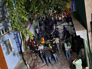 MNDF Fire & Rescue and members of the public working together to tackle the fire at G. Preside