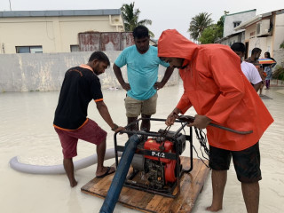 Water pumps are being used to drain the floods on the roads