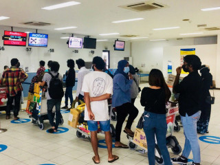 Individuals at the check-in gate