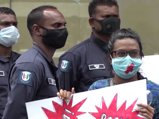 Rae Munavvar at a protest against sexual violence